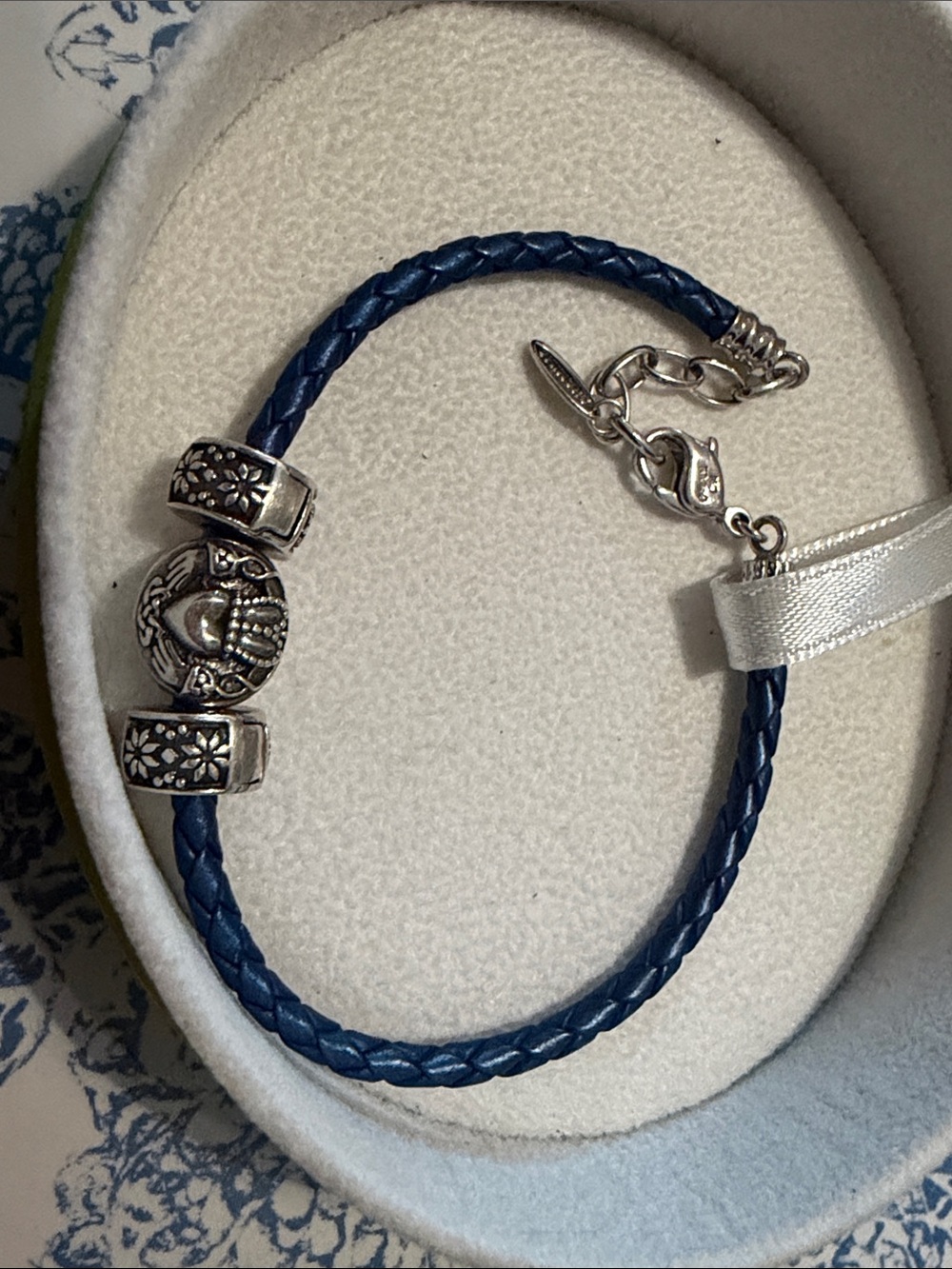 Chamilia blue leather bracelet with three claddagh and flower charms - Picture 3 of 3